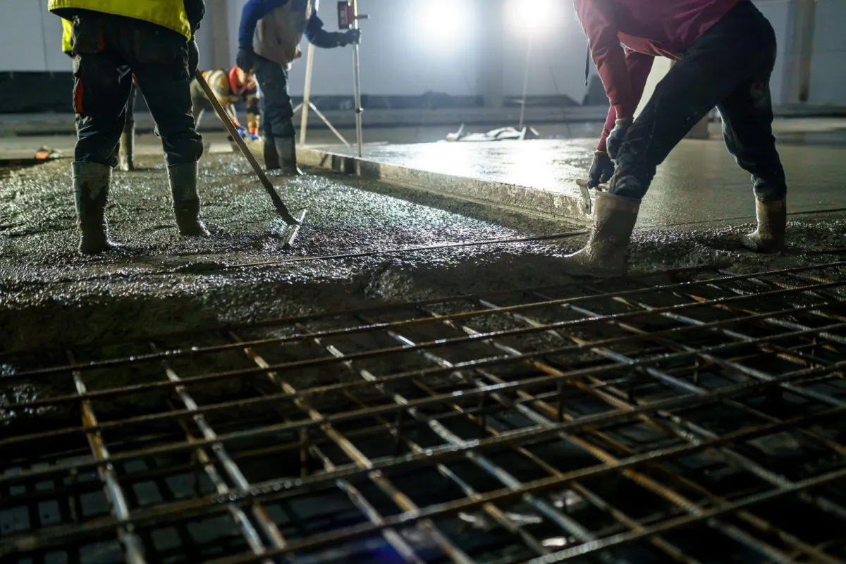 Contractors doing Concrete pour over rebars