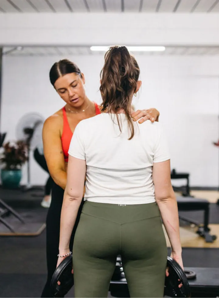 woman with female personal trainer personalised program the evolved all female gym brisbane