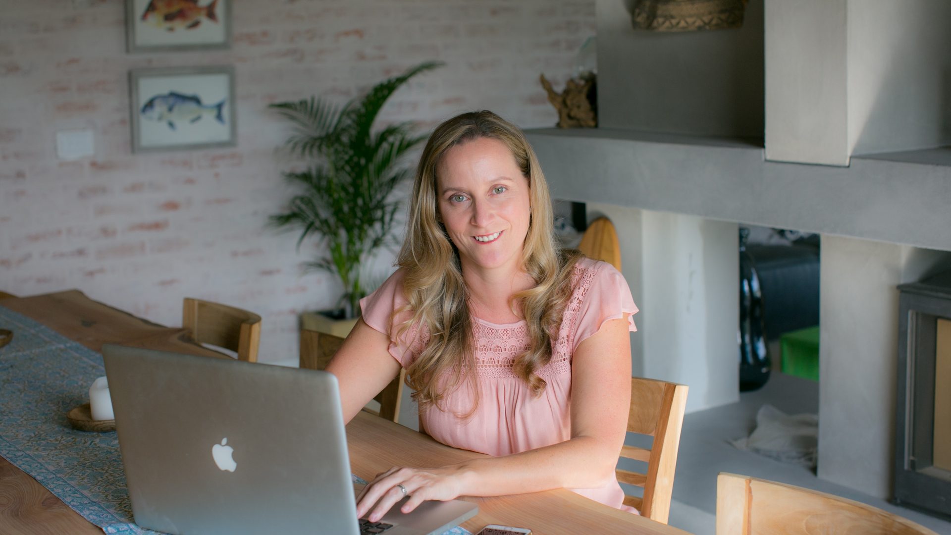 Chanelle Segerius-Bruce writing copy on her laptop at home in Cape St Francis