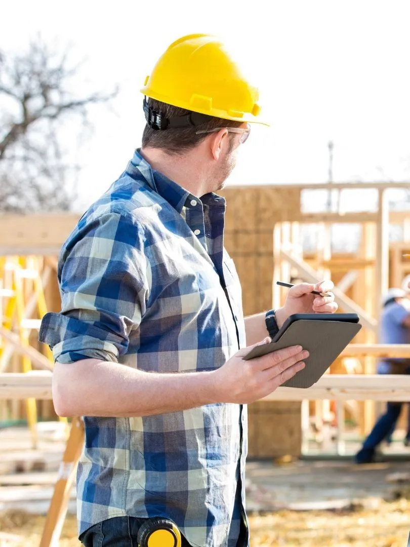 General contractor reviewing home remodeling plans on-site in Irving, TX