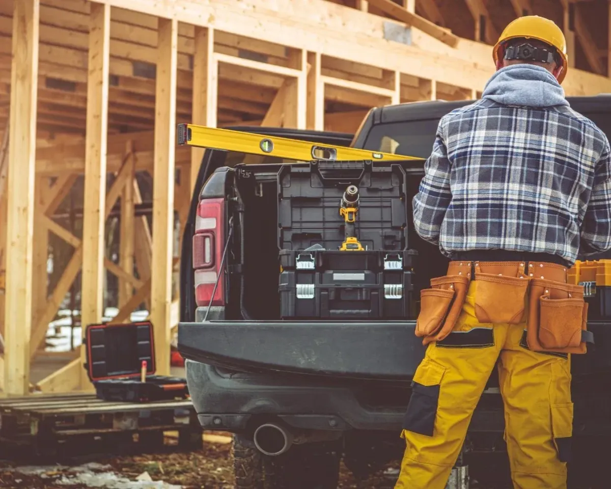 allas general contractor working on a home construction project with tools and equipment