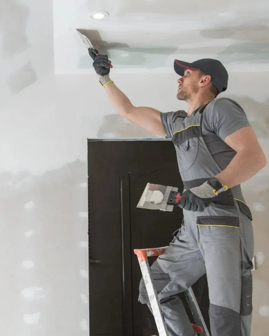 Home remodeler in Little Elm TX applying drywall finish during interior renovation