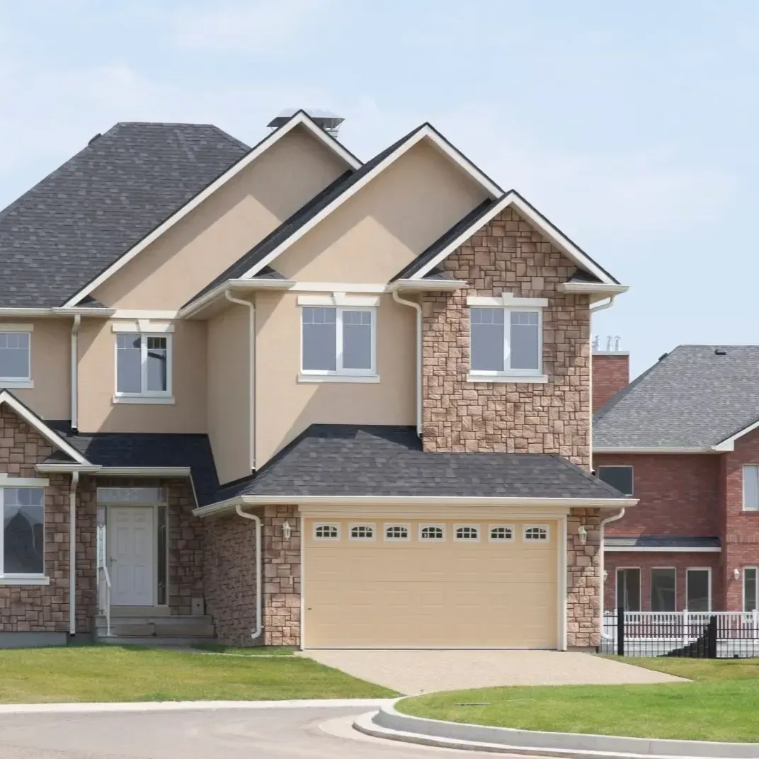 Exterior home remodeling in Sachse TX with updated stone siding, new roofing, and modern finishes.