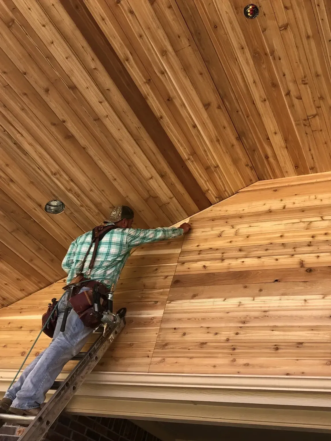 Installing tongue and groove cedar ceiling on a patio cover in Coppell, TX