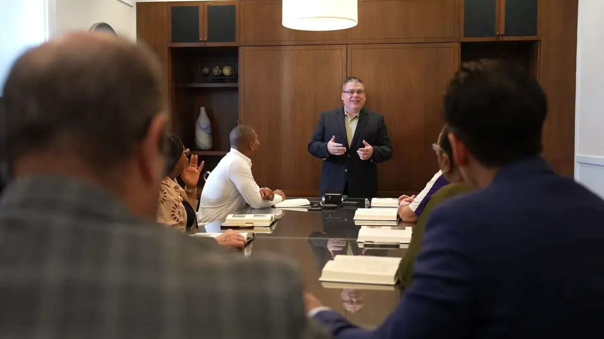 Gary L. Barker delivering a message to a executive group.