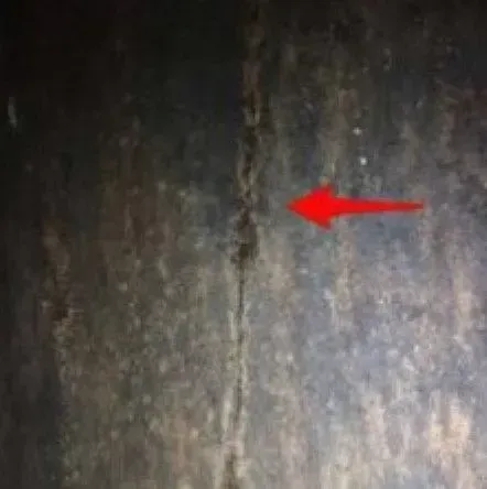Damage to a chimney is not always obvious; this cracked liner was found in the middle of the chimney and was only visible when Chimney Works ran a camera down the flue.