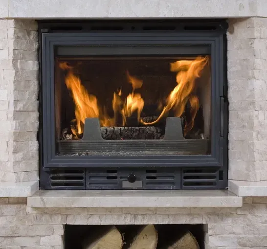 Newly installed fireplace firebox interior by ChimneyWorks in Cincinnati, featuring smooth, clean fire-rated panels and safe construction.