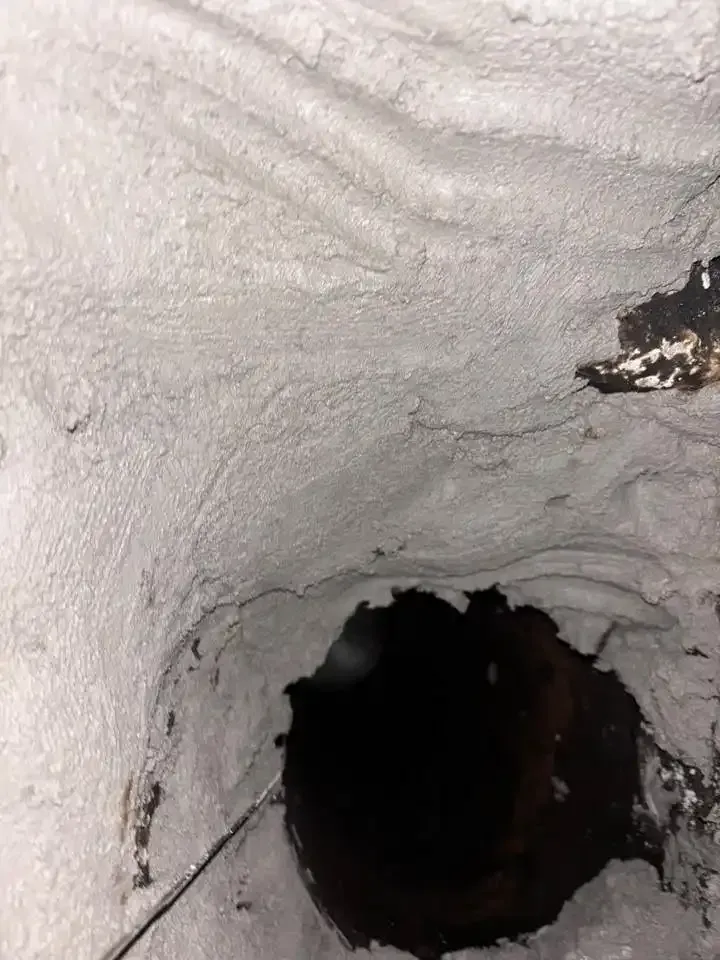 Properly parged chimney smoke chamber in a Cincinnati home, with smooth sealed walls for safe airflow and efficient smoke ventilation.