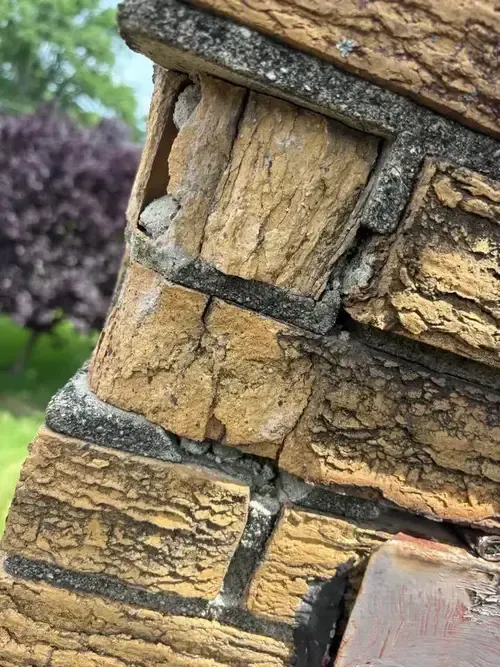 Damaged and flaking bricks (spalling) due to freeze-thaw cycles—one of the most common issues in Cincinnati chimneys.