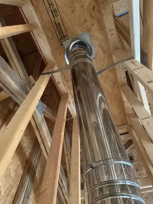 Chimney liner installation inside flue on a Cincinnati home by ChimneyWorks, showing a newly inserted stainless steel liner for improved fireplace safety and ventilation.