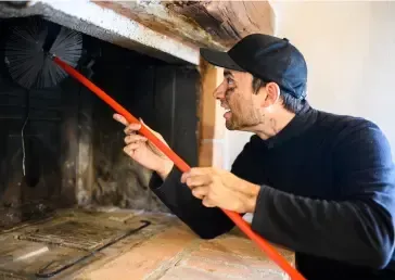 Chimney Works experts providing thorough chimney sweep services for safety and optimal performance.