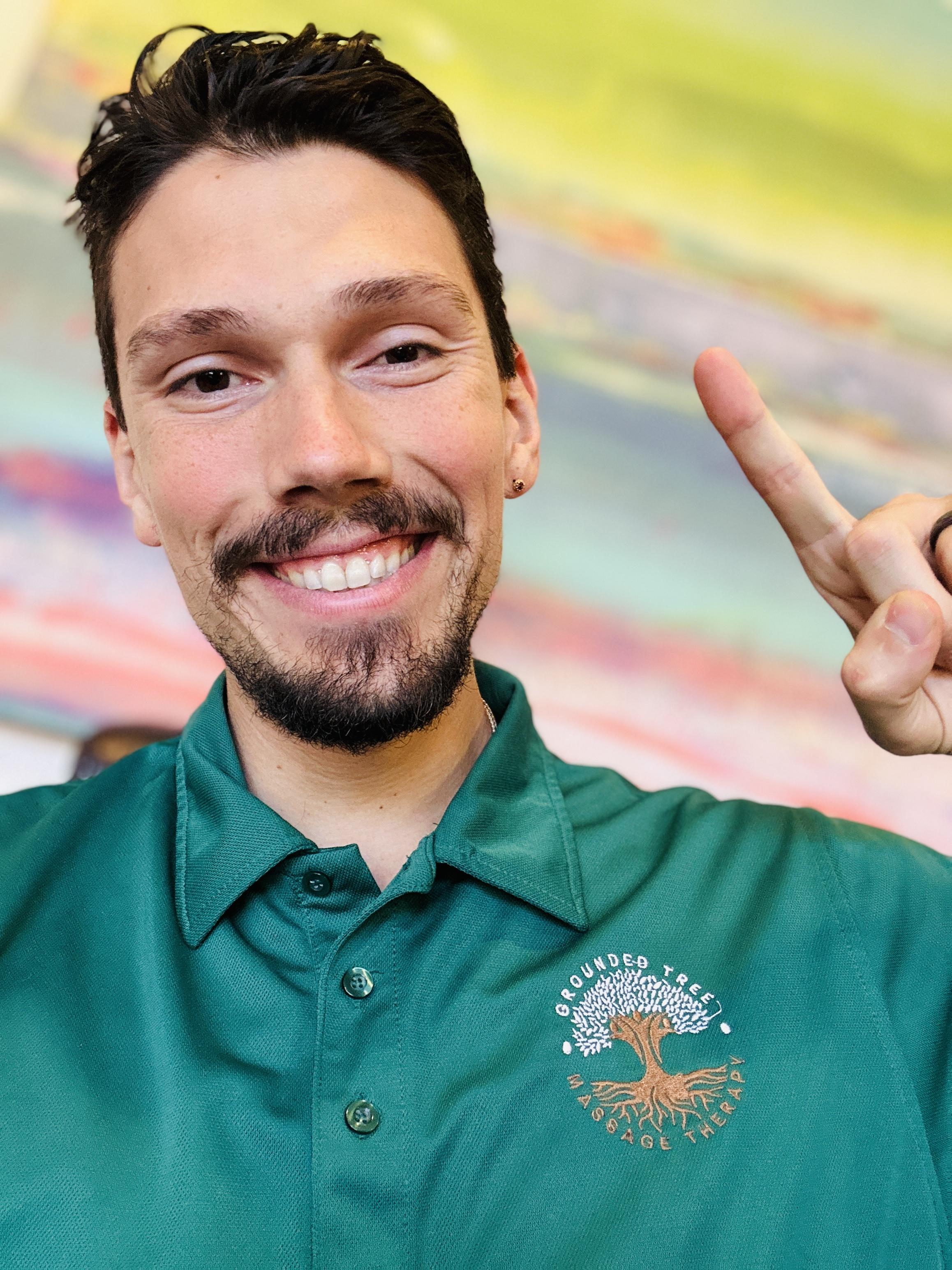 Men exercising outdoors with an ab roller wheel.