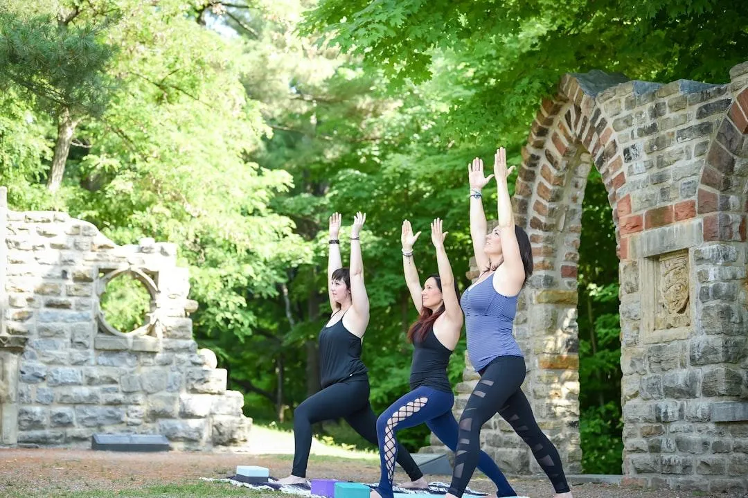 Group of women exercising in a park.