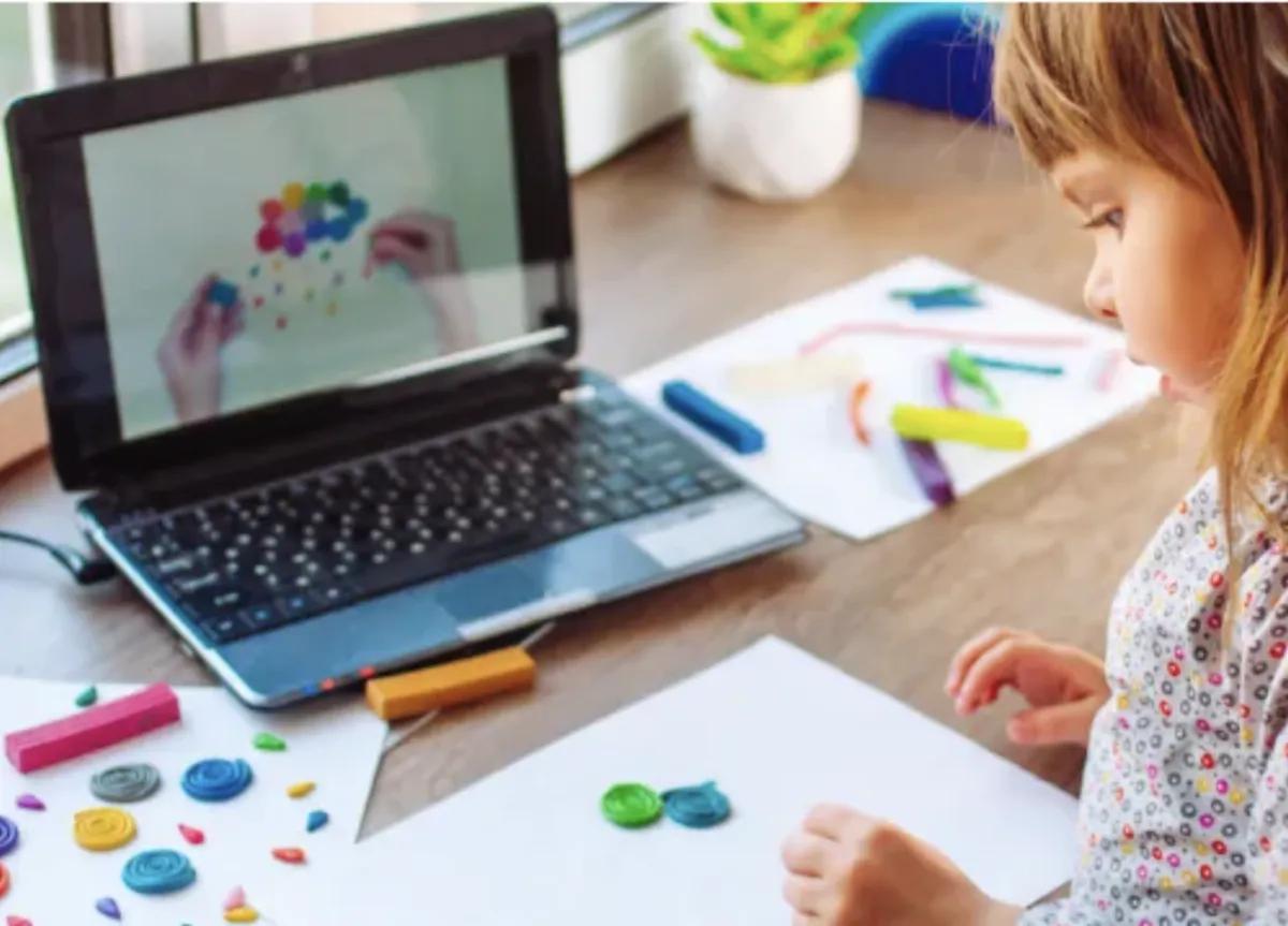 Girl follows directions during arts and crafts time.