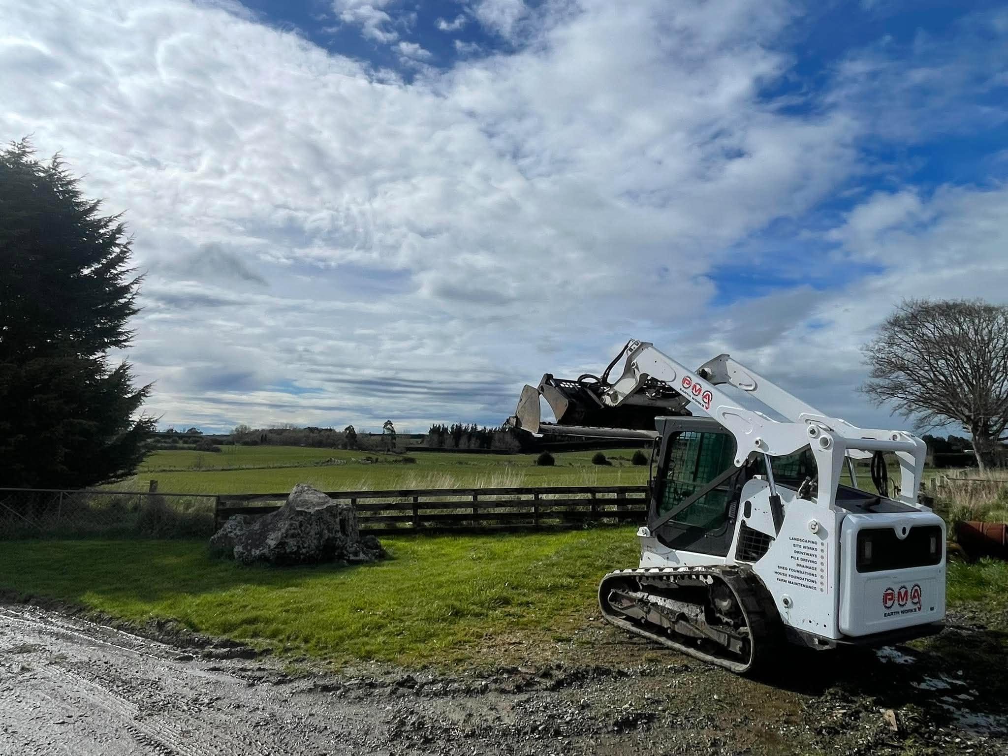 PMA Earth Works tracked loader with grapple on a rural Southland property