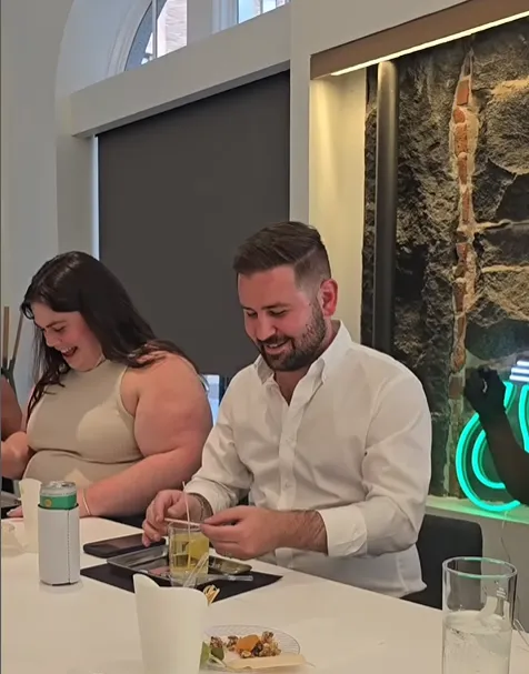 Corporate team smiling and enjoying making candles.