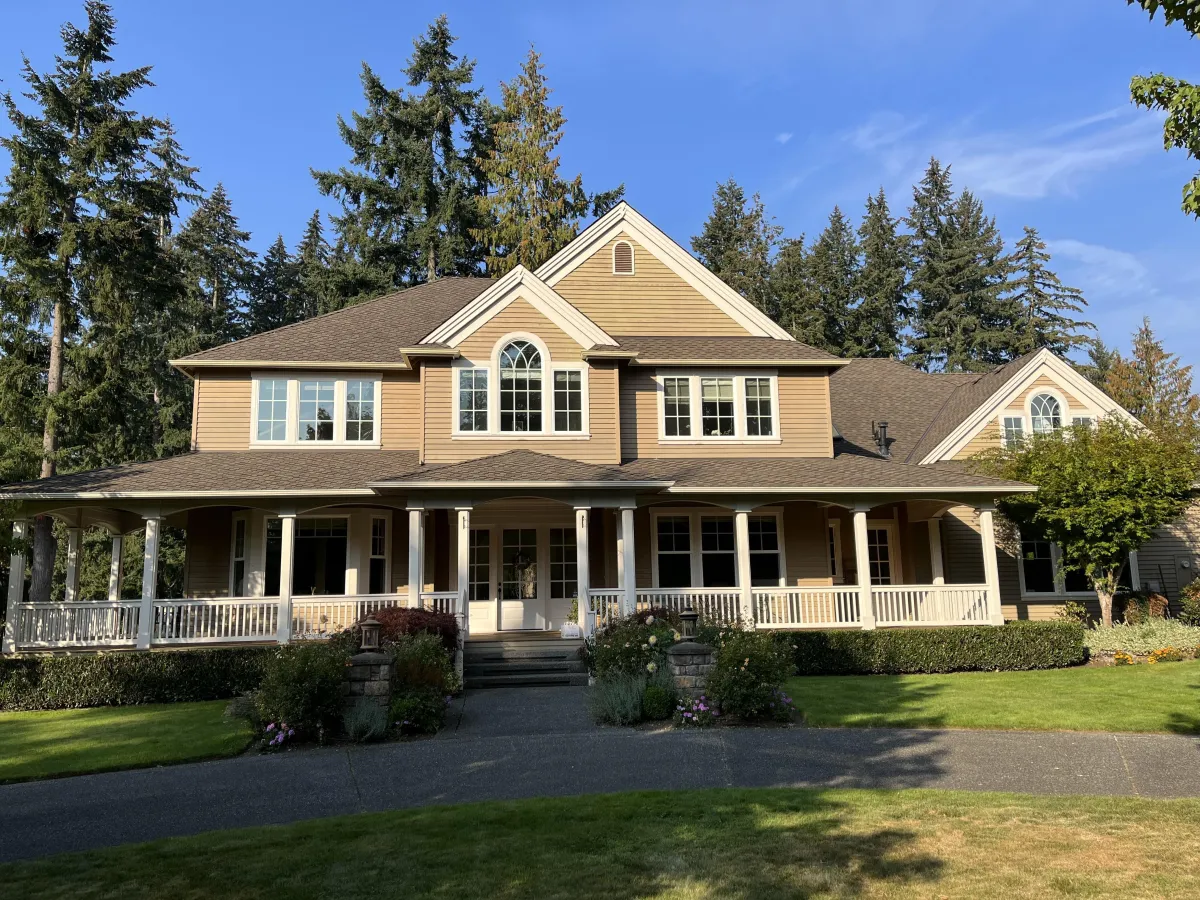 Exterior house painting with durable weather-resistant finish