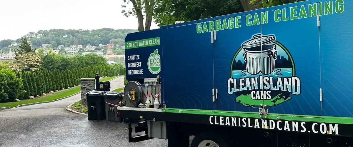 Garbage can cleaning service truck parked in residential driveway