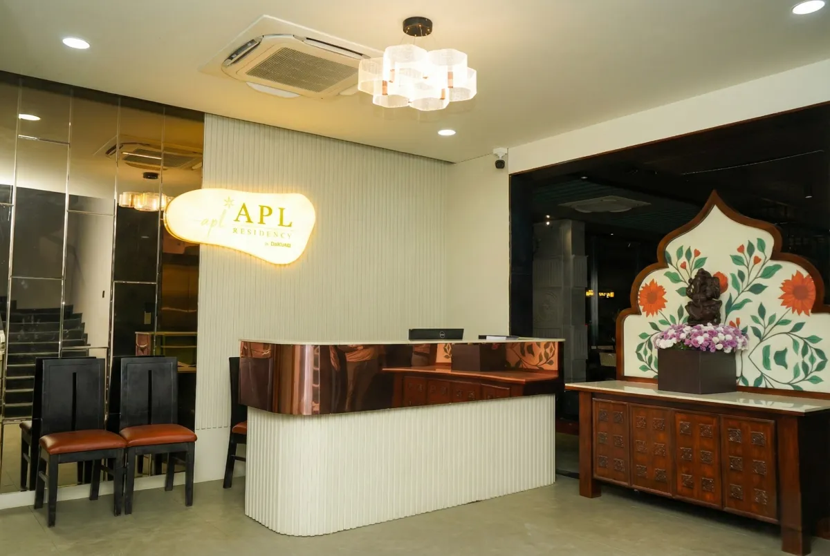 Crestfield Residency exterior at sunrise with entrance canopy and valet area