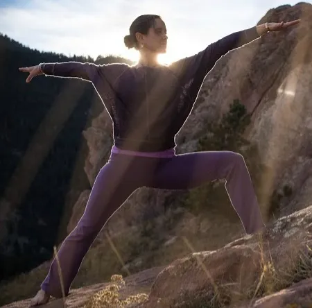 Annette in Warrior pose in nature