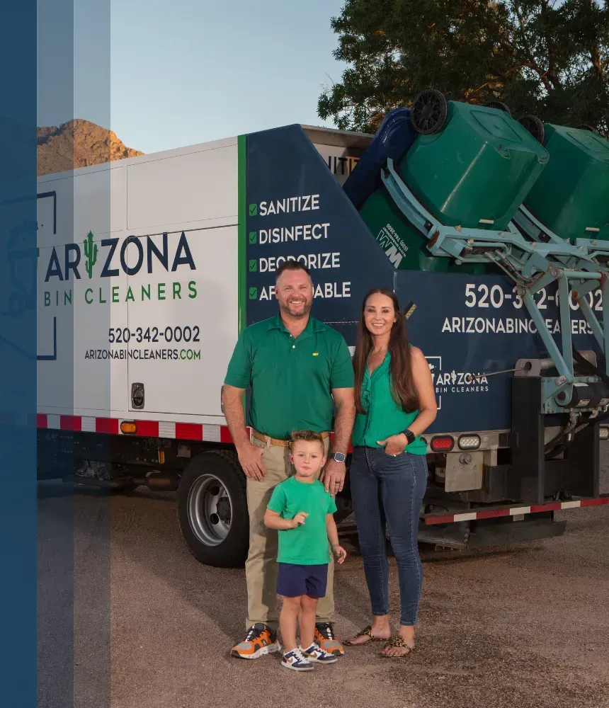 Family standing in front of Arizona Bin Cleaners truck with green trash bins lifted for cleaning in Tucson, AZ