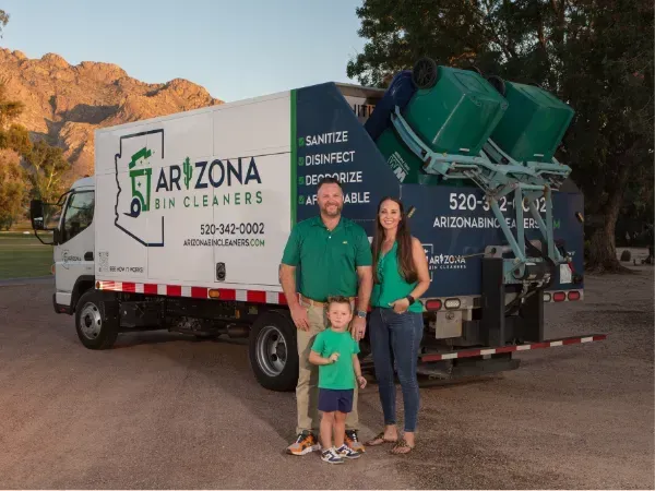 Owner of Arizona Bin Cleaners standing proudly in front of eco-friendly trash bin cleaning truck in Tucson, AZ. 