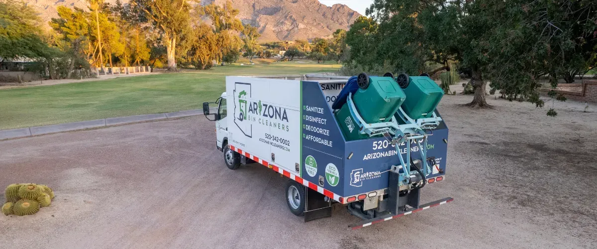 Arizona Bin Cleaners truck at work in a Tucson neighborhood with scenic mountain backdrop, showcasing eco-friendly trash bin cleaning service.