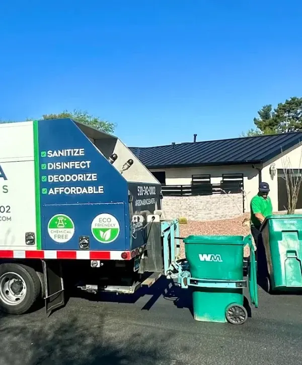 Professional trash bin cleaning service with eco-friendly sanitation truck in residential area
