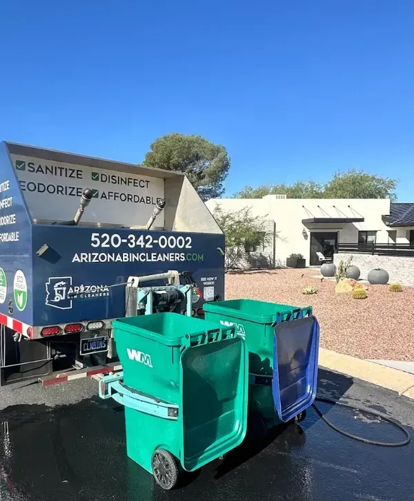 Arizona Bin Cleaners truck servicing residential garbage bins in a suburban neighborhood
