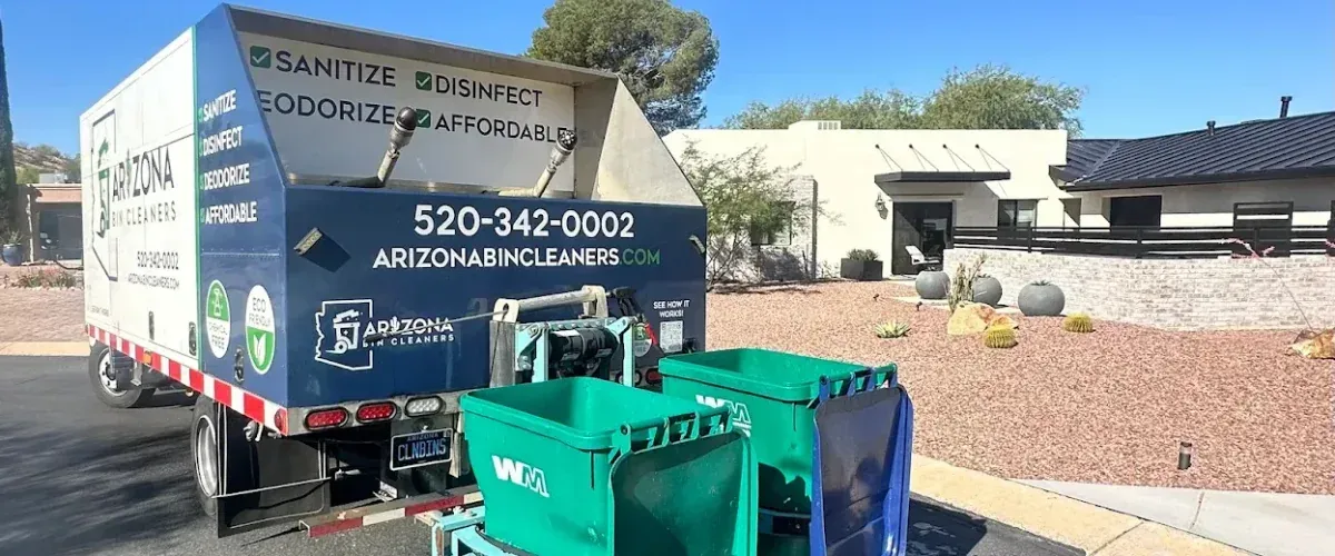 Rear view of Arizona Bin Cleaners truck using hydraulic lift to clean residential trash bins