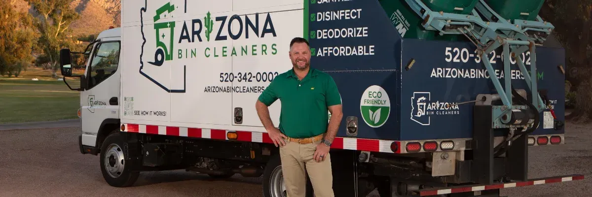 Arizona Bin Cleaners owner standing beside branded bin cleaning truck.