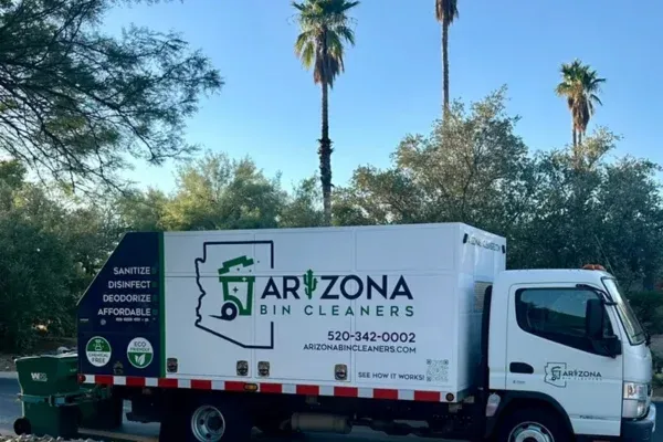 Arizona Bin Cleaners sanitation truck driving through residential area.