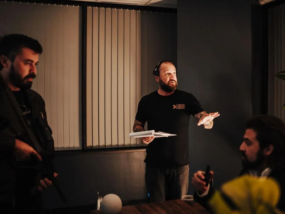 Production crew coordinating a professional video shoot on set