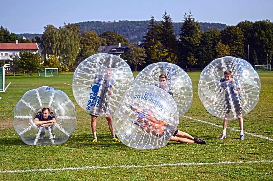 four man running on the field