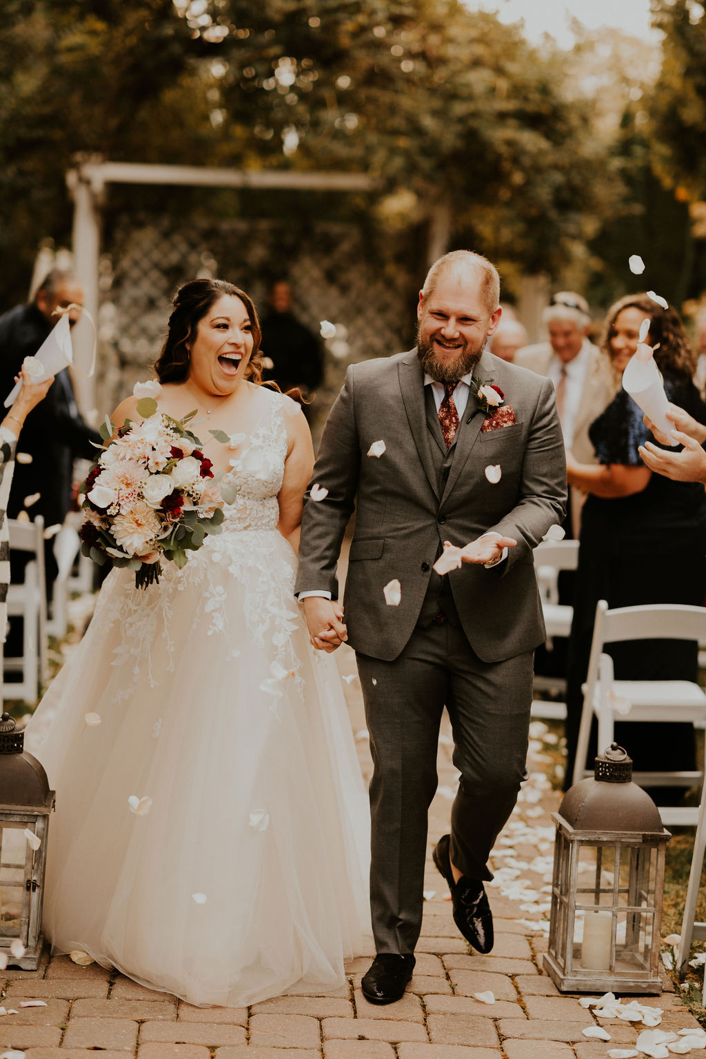 couple dancing on the dance floor celebrating with family and friends.