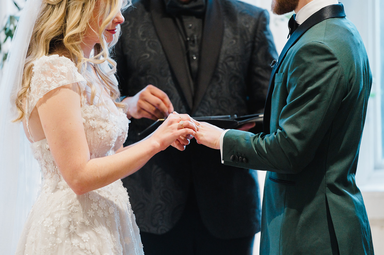 leeroy dancing with bride and groom on the dance floor.