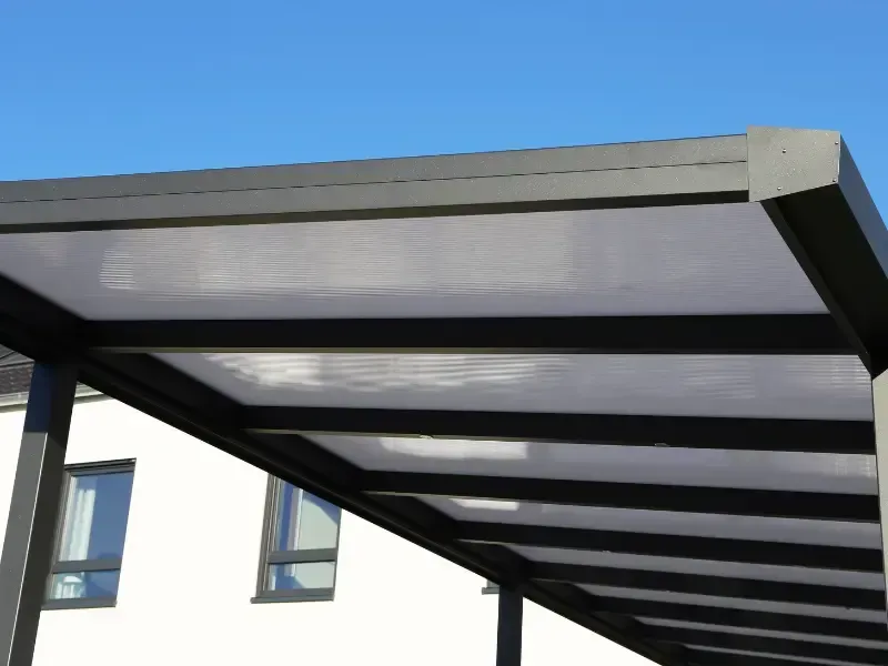 Close-up of aluminum carport roof panels and frame.