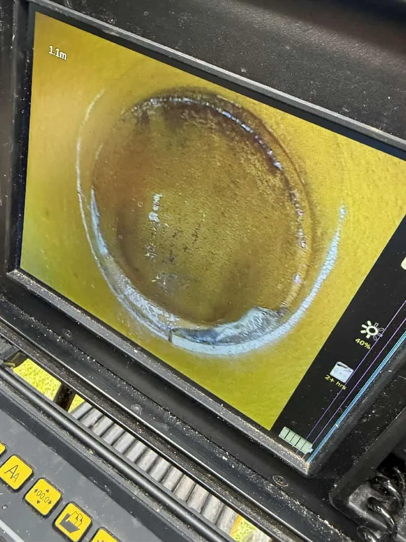 I'll create an appropriate alt text for this image that incorporates your specific keyword: "CCTV inspection revealing cracked drain in Bournemouth requiring professional repair by 1st Call Drainage.