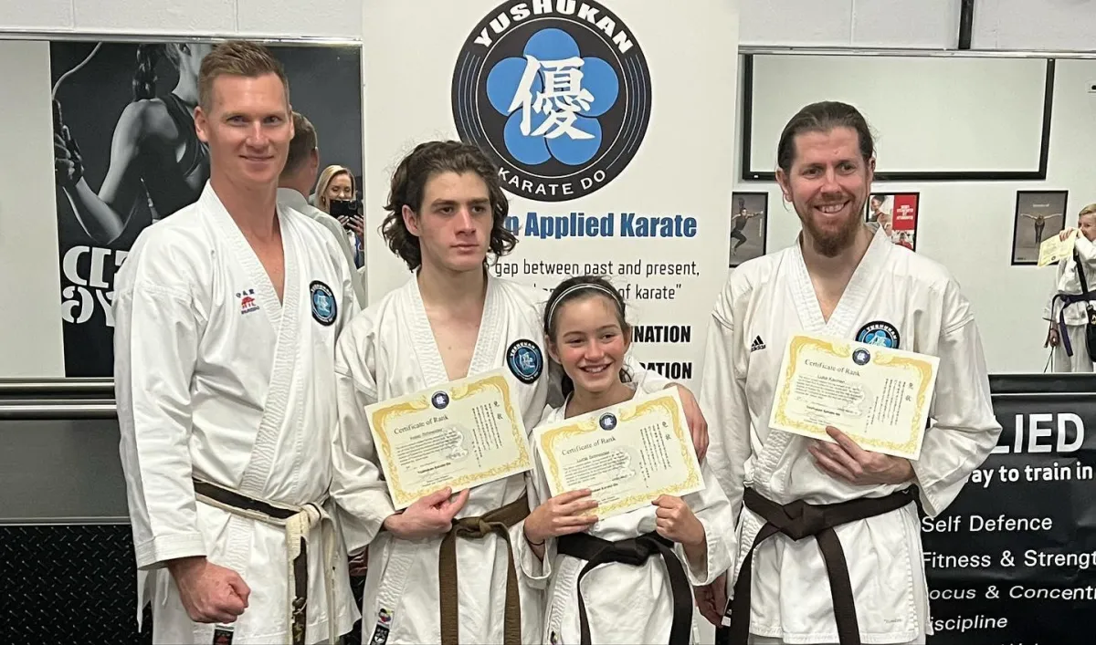 Sam giving certificates to his karate students in Perth