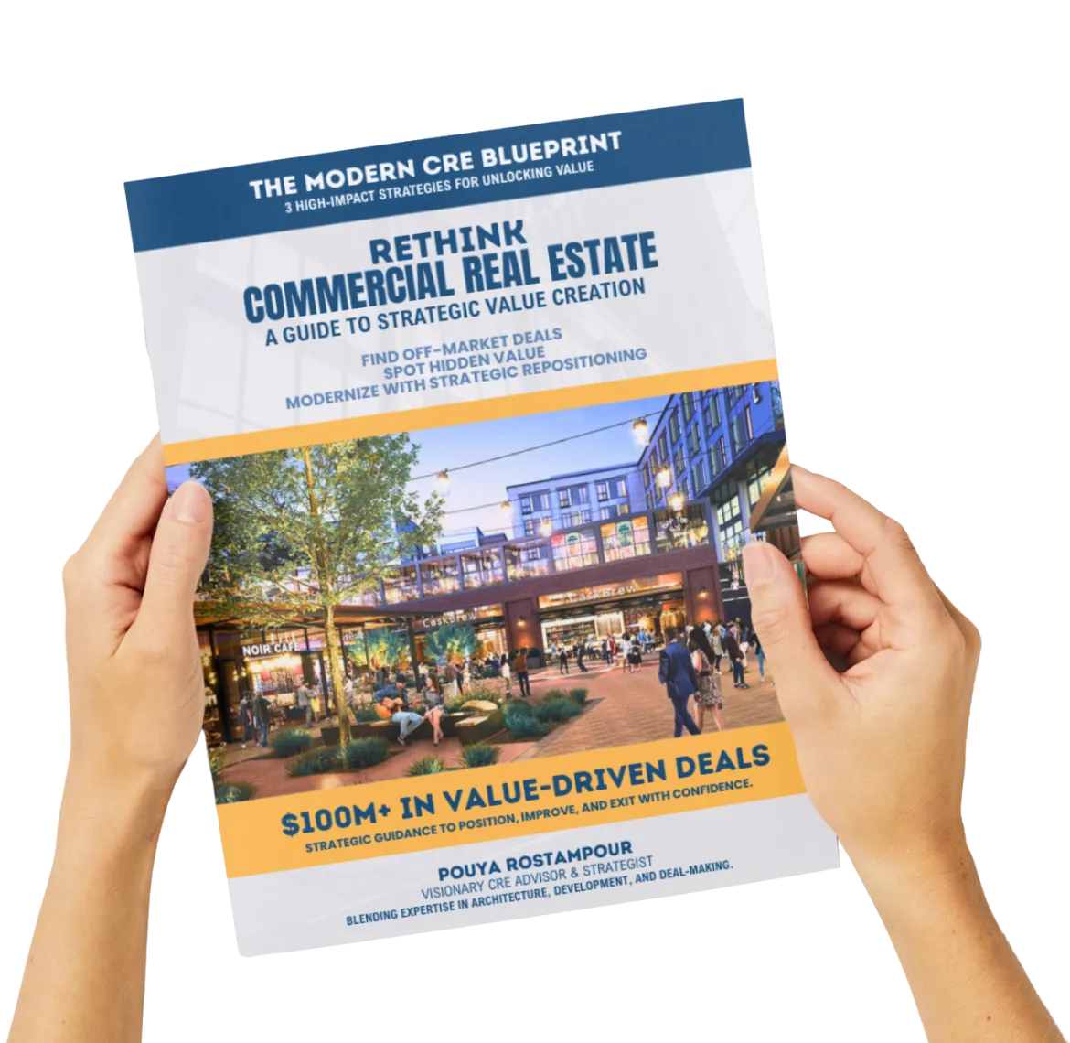 Hands holding The Modern CRE Blueprint guide by RSTM Properties — Southern California commercial real estate experts.