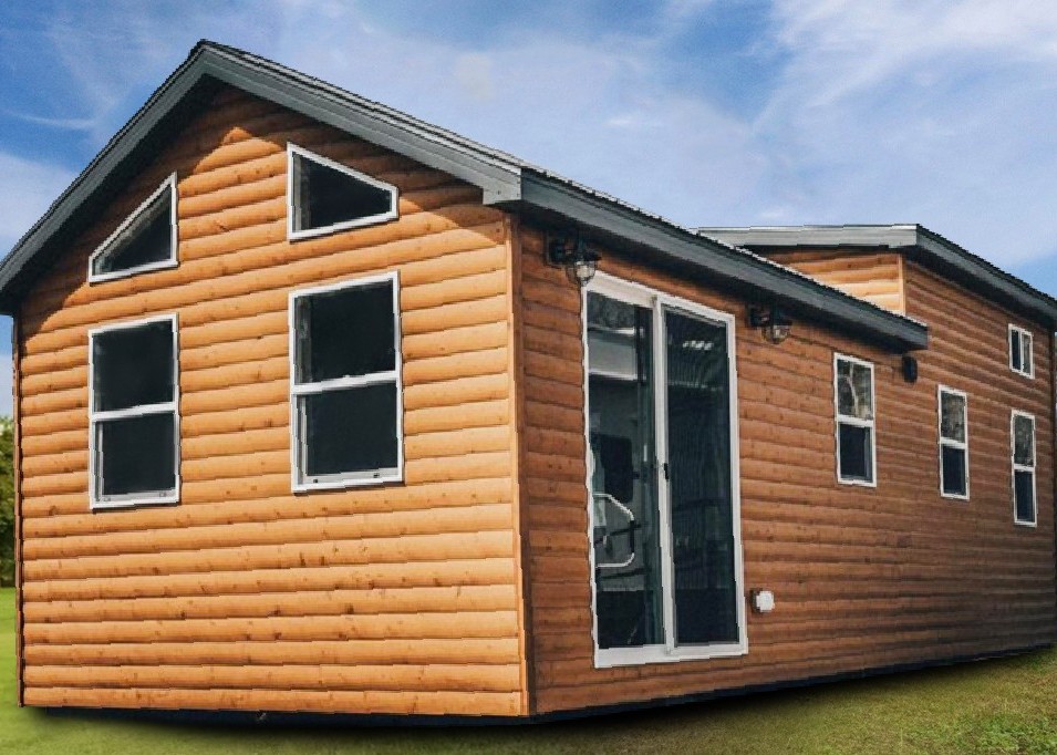 Tiny home exterior featuring a wooden facade, large windows, and a porch, representing the Trailblazer model by Snake River Tiny Homes.