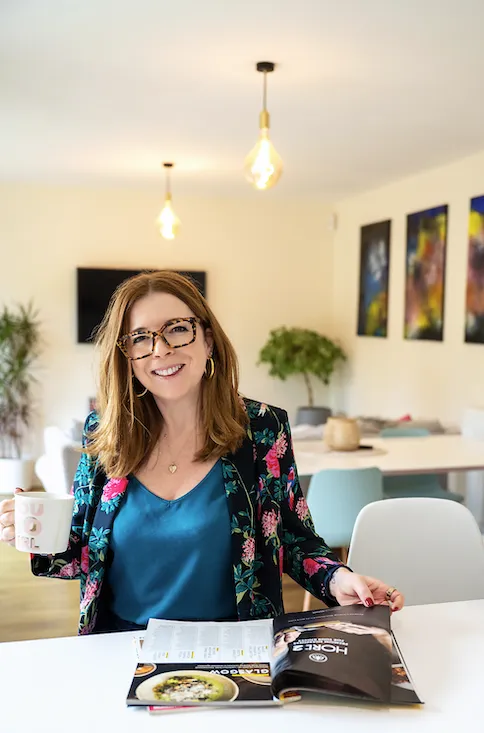 Ailsa Hichens with magazine holding a mug