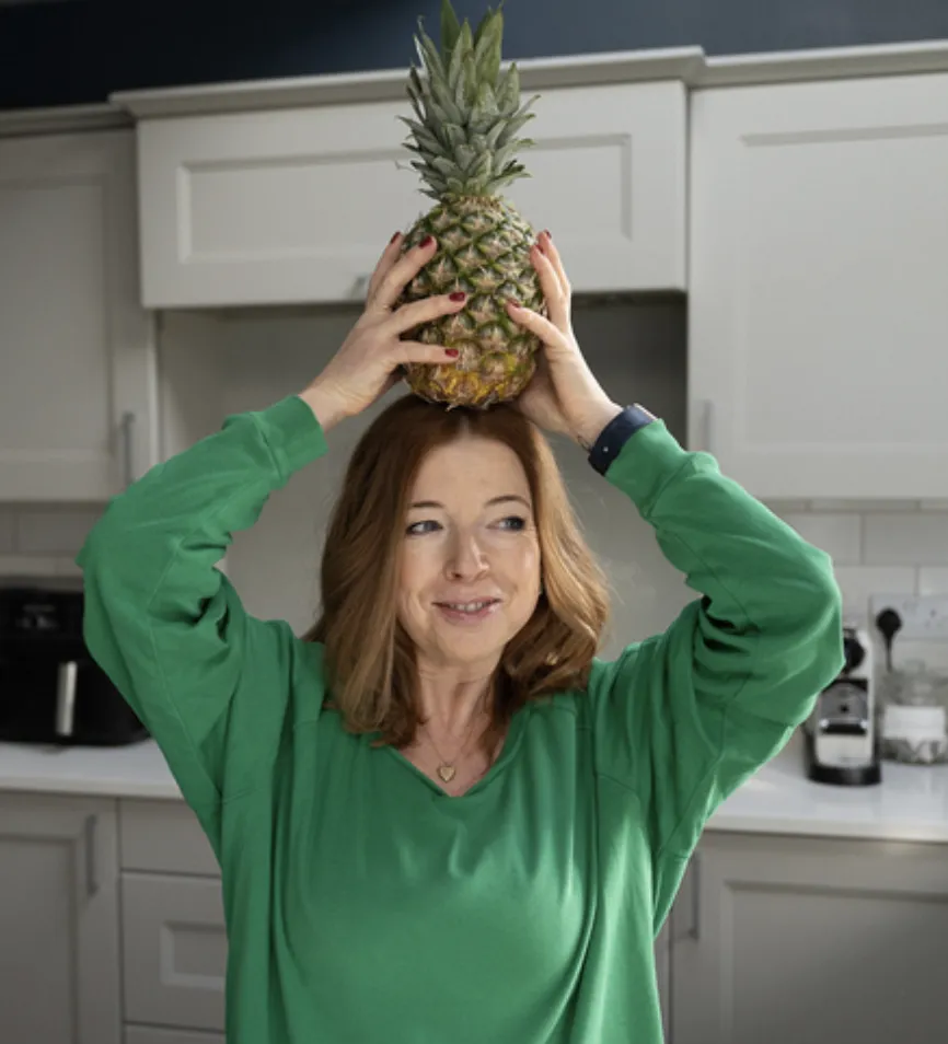 Ailsa Hichens with a pineapple on her head