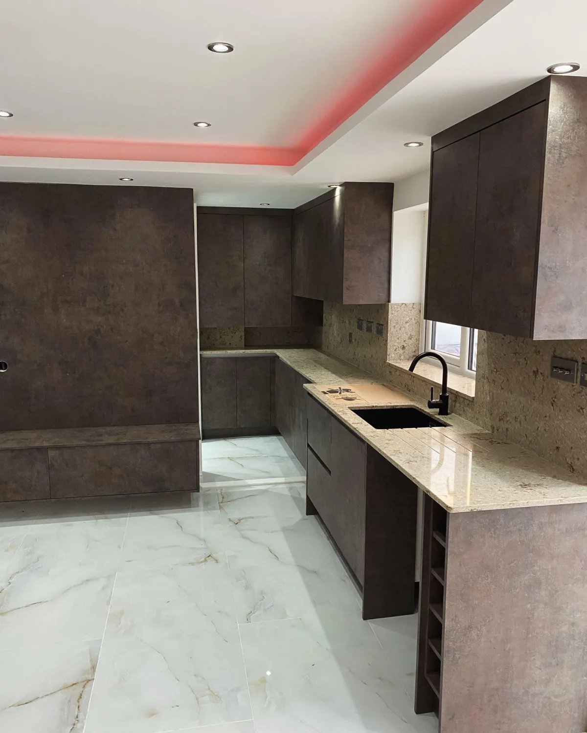 Complete luxury refurbishment of a central London flat with custom-built kitchen and marble flooring.