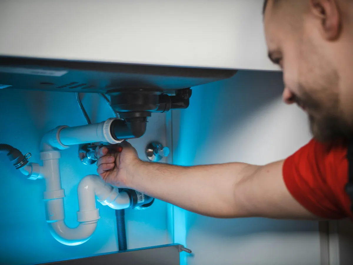 Plumber installing piping on a construction project