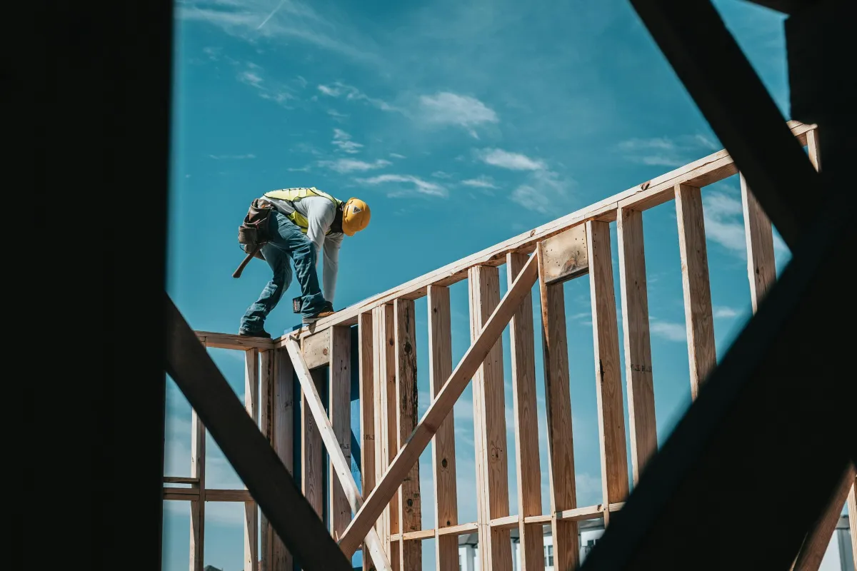 Carpenter building wood framing on a construction project