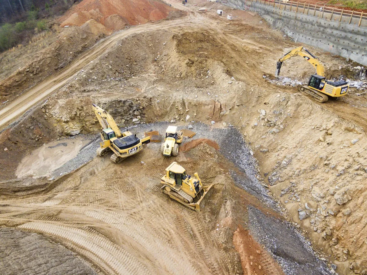 Excavator and trench work on an active construction site