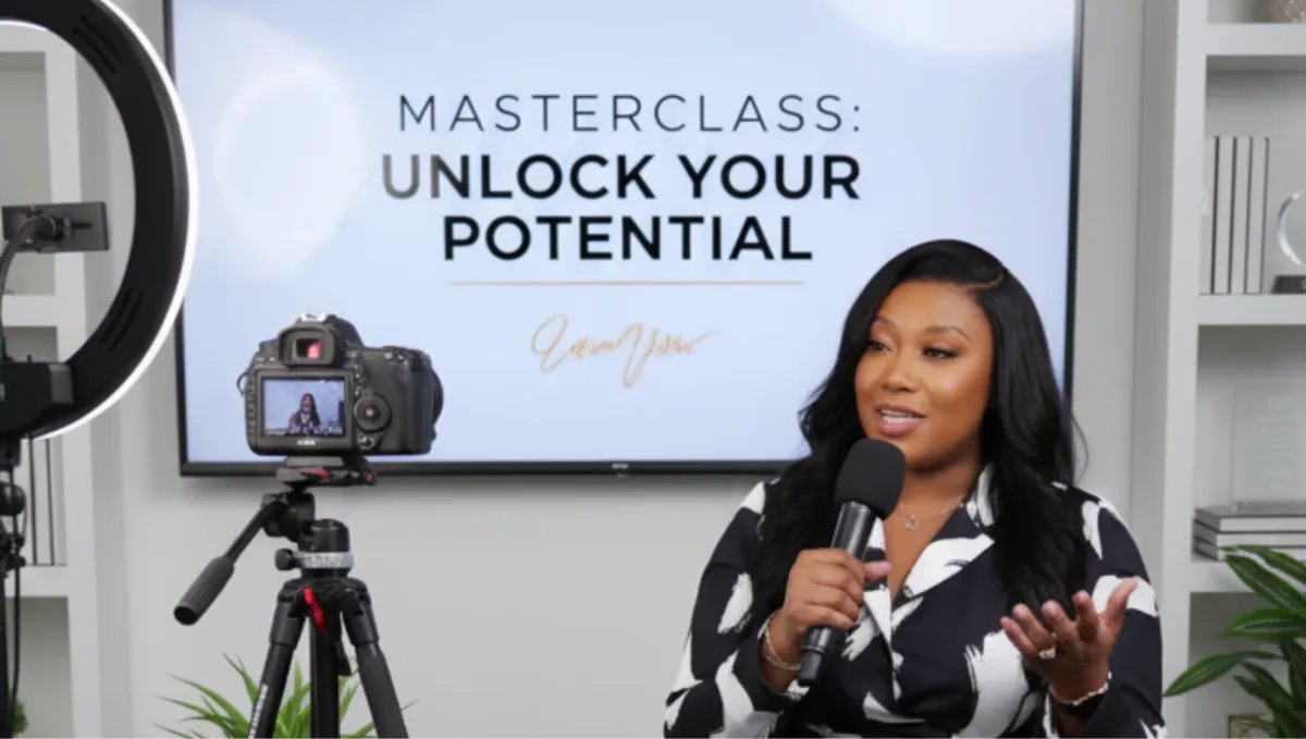 Presenter recording a masterclass in a small studio with camera and softbox