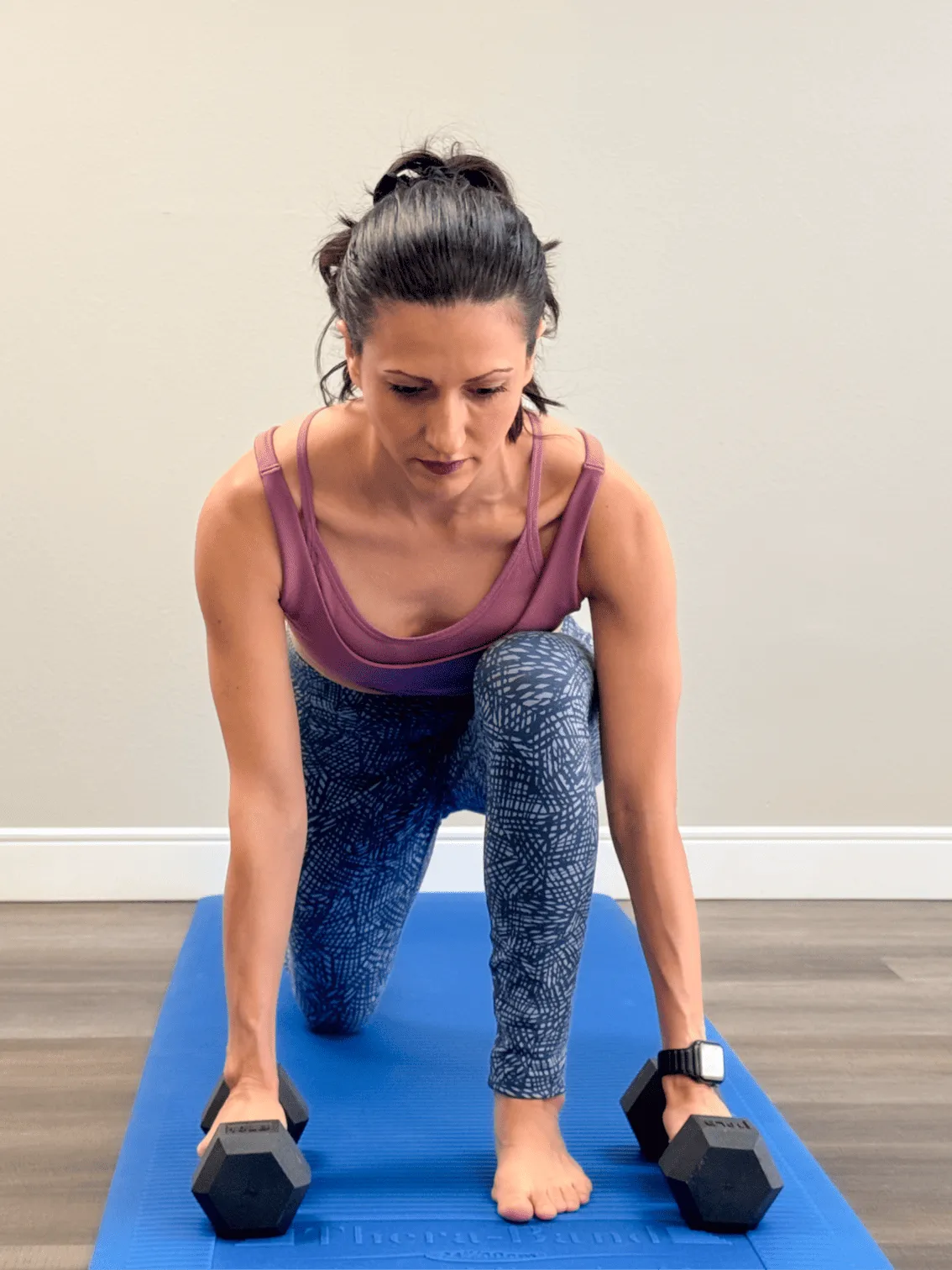 Galina Penev, certified personal trainer, demonstrating a strength training exercise