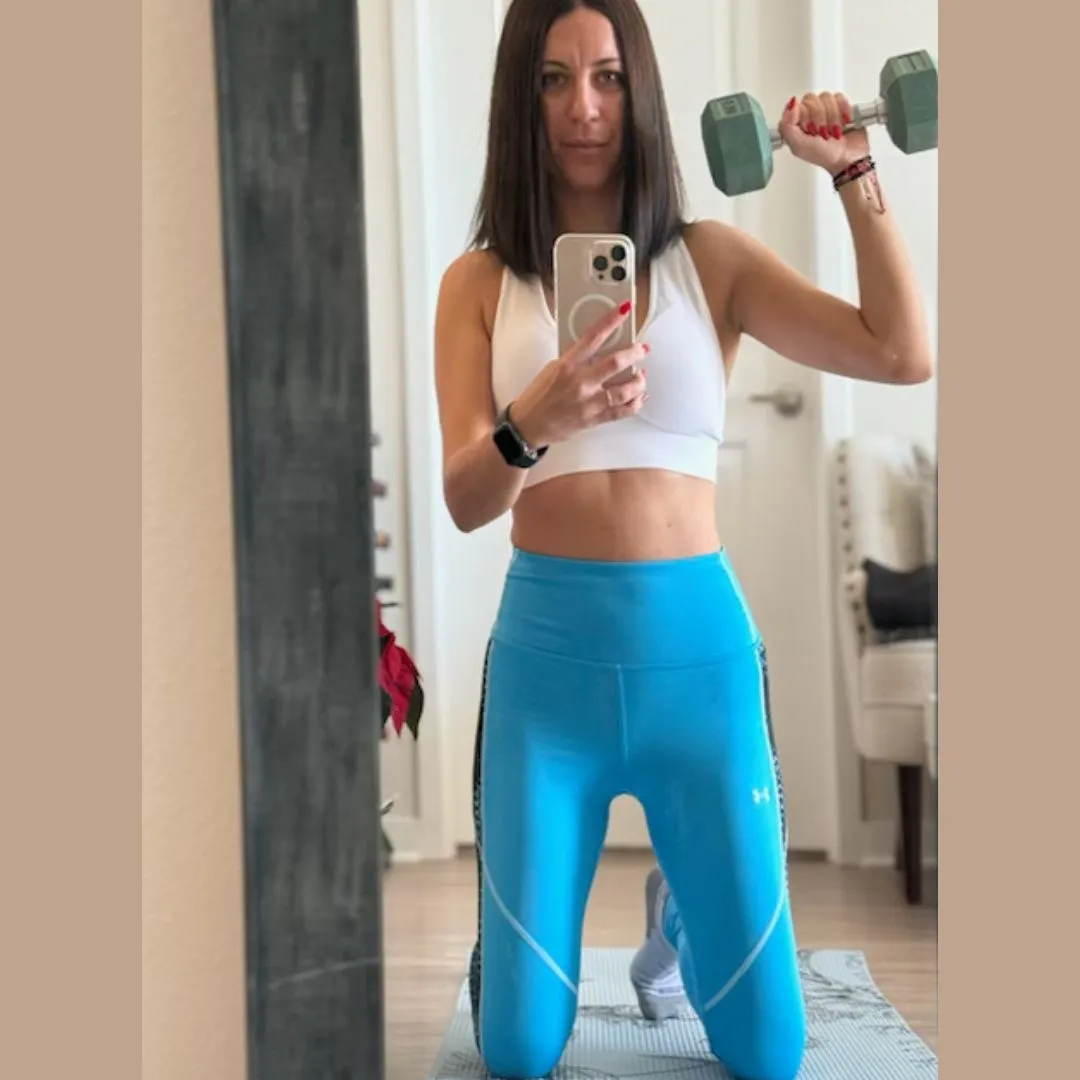 Kalina doing a dumbbell workout at home as a Zen Core client